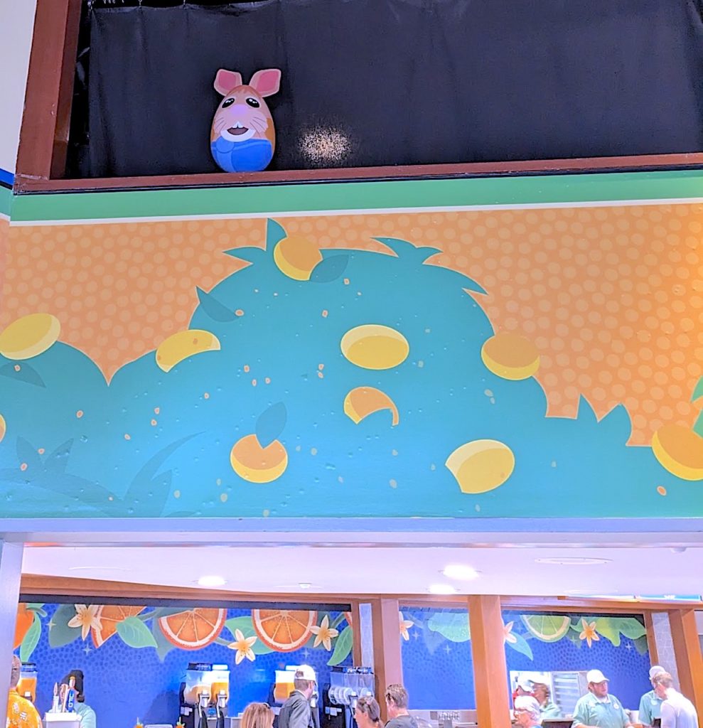 Egg statue of Disney Bunny on top of orange themed wall